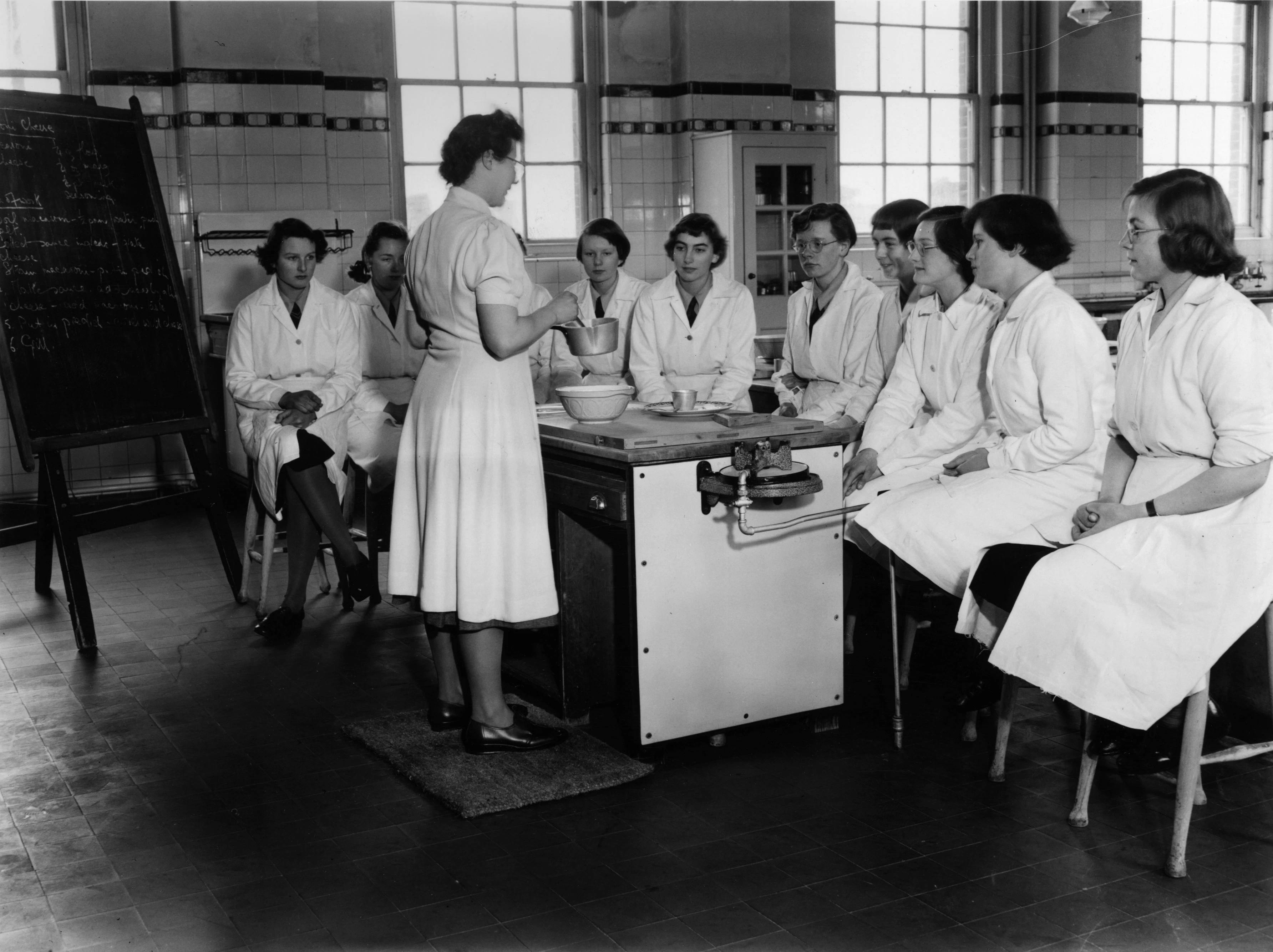 3rd March 1953: Girls in the lower fifth form of the girl's School at Christ's Hospital, Hertford, are given a home economics lesson. Getty Images/Harrison/Stringer