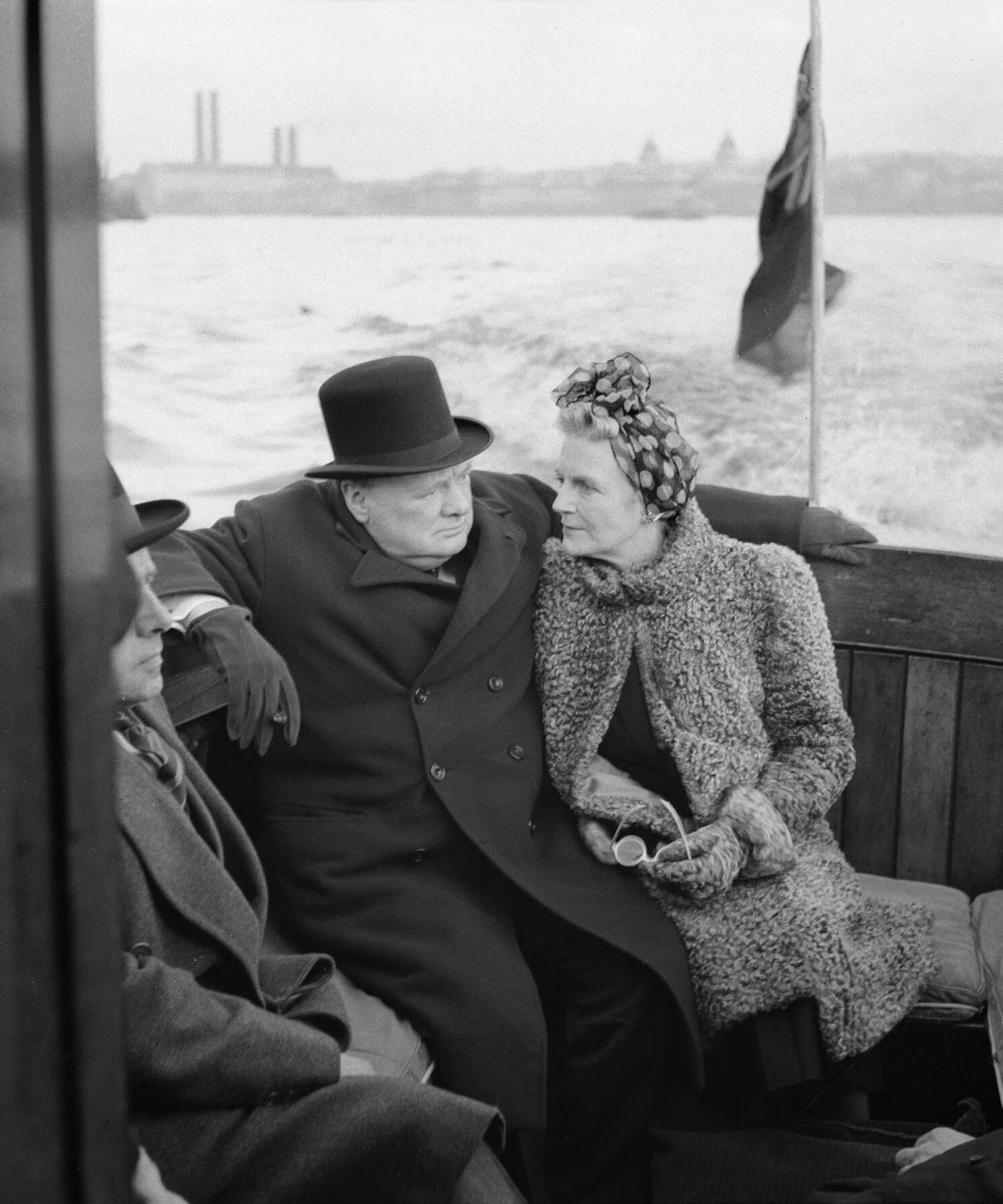 Winston Churchill and his wife, Clementine, on board a naval auxiliary patrol vessel during a visit to the London docks, 25 September 1940. H4367
